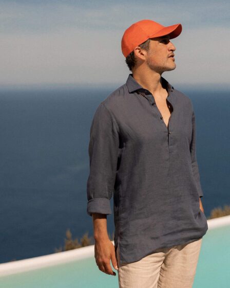 man wearing an orange cap on a sunny day
