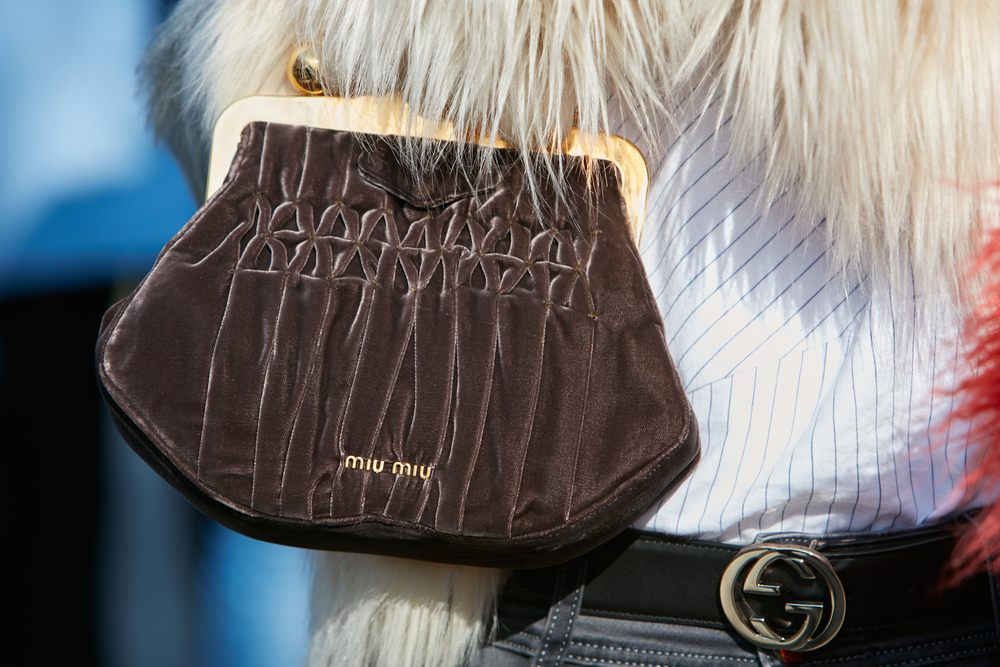 A close up of a Miu Miu handbag on someone's arm