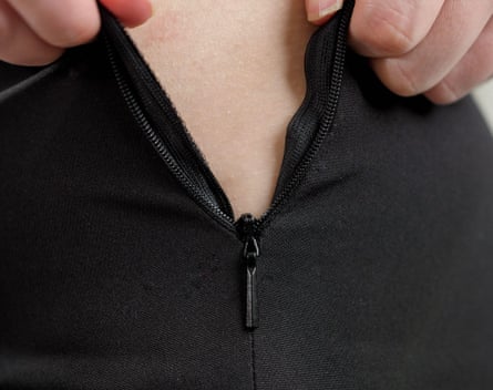 A zipper closing on a tight fitting garment
