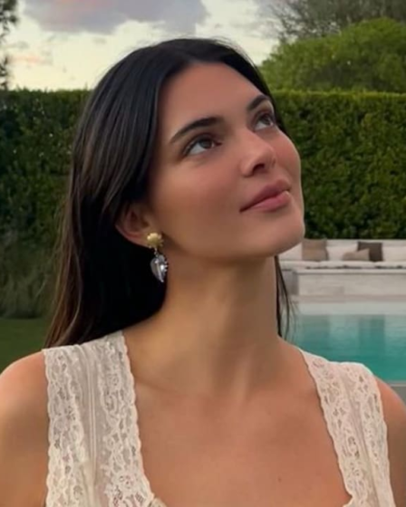 Kendall Jenner poses in nothing but a button-down shirt while relaxing in bed: ‘off-duty attire’