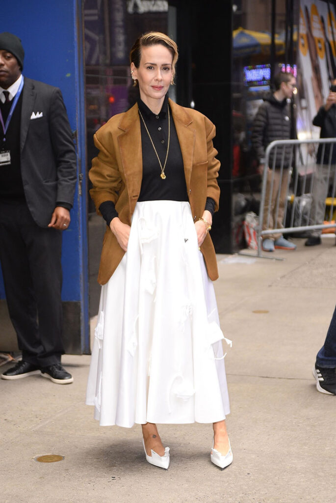 BGUK_2761181 - New York, NY  - Sarah Paulson stuns in a white Prada skirt paired with a black top and a suede jacket as she exits the Good Morning America morning show in New York City. Pictured: Sarah Paulson BACKGRID UK 27 OCTOBER 2023  UK: +44 208 344 2007 / uksales@backgrid.com USA: +1 310 798 9111 / usasales@backgrid.com *Pictures Containing Children Please Pixelate Face Prior To Publication*