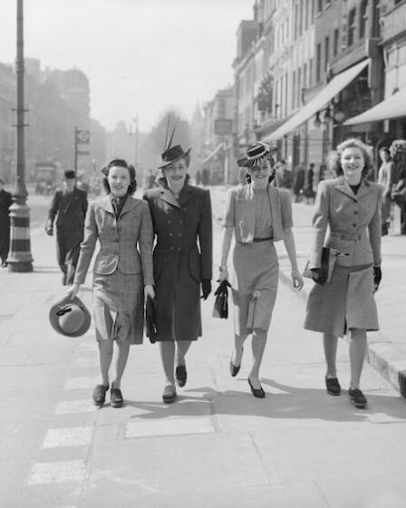 Four women walk down the street during the second world war