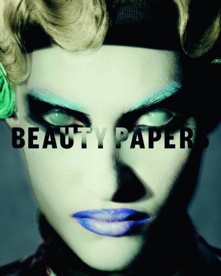 Paolo Roversi's cover for Issue 11 of Beauty Papers features a model with cloudy eyes, green eyebrows, and blue lips.