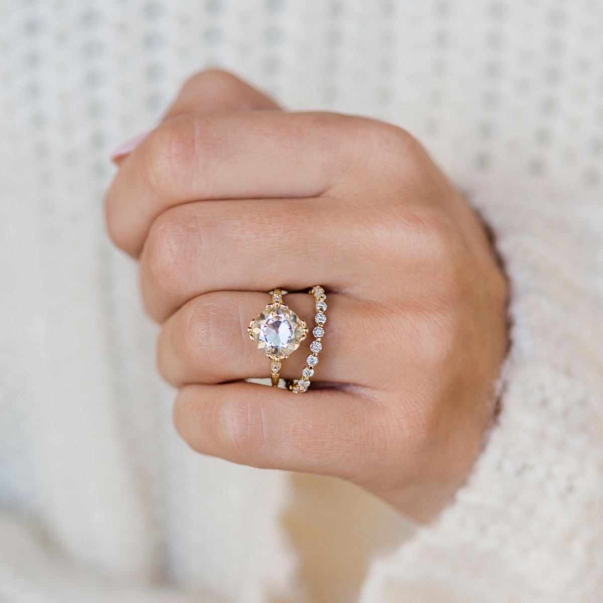 Woman's hand with vintage e-ring and band
