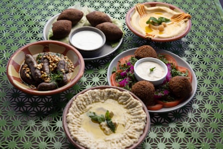 Watany Manoushi meze (clockwise from left): makanek, kibbeh plate, baba ganoush, falafel plate and hummus tahini.