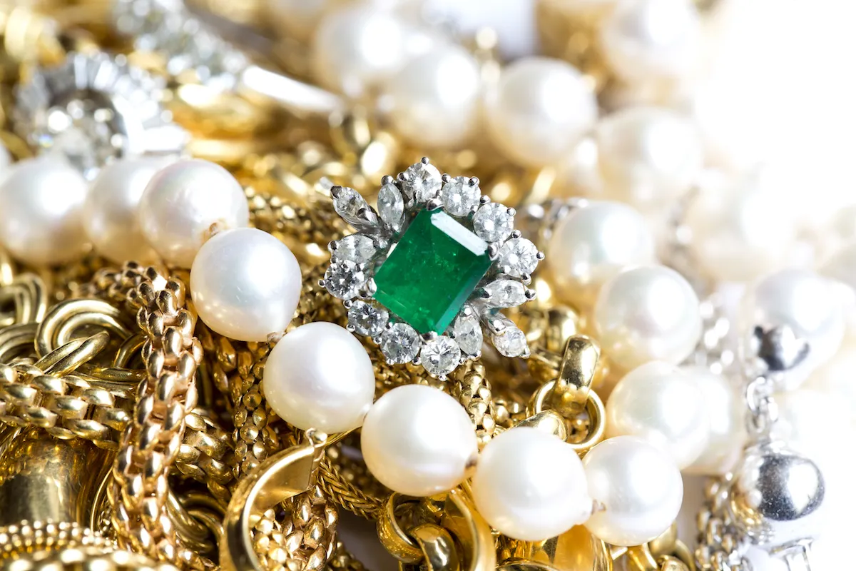 Closeup of gold jewelery with precious stones