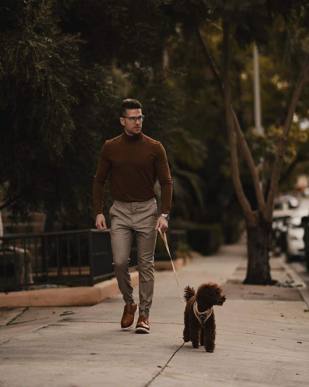 walking the dog in a casual outfit