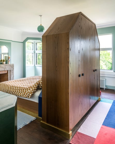 Dreamy: the bedroom with unusual wardrobe headboard.