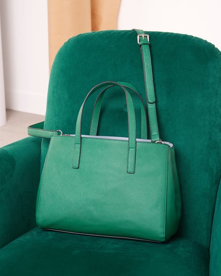 Green leather bag on green chair