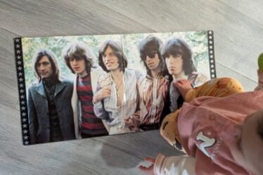 Olivia with a Rolling Stones record.