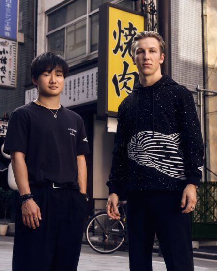 Alpha Tauri F1 drivers Yuki Tsunoda and Liam Lawson showing off the Red Bull-owned fashion line's collaboration with Californian artist Brendan Monroe.