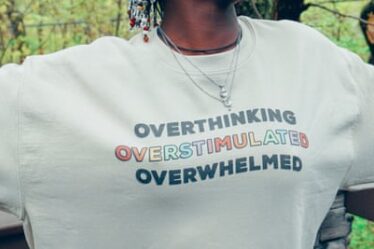 A sweatshirt branded with a mental health-themed slogan.