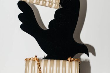 Keyholes and roughly cast bronze are key codes of Schiaparelli's revival, as seen on the brand's new "Schlap" bag.