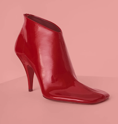 A single red ankle boot with a blunt square toe.