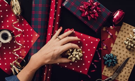 Woman wrapping Christmas gifts