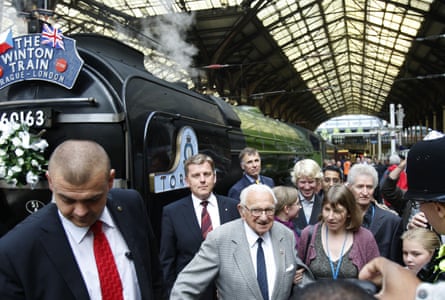 Nicholas Winton, centre, next to the commemorative train at Liverpool Street station, London, in 2009.