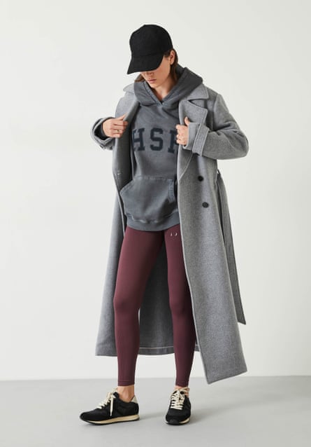 Female model in grey hoodie with long coat and leggings 