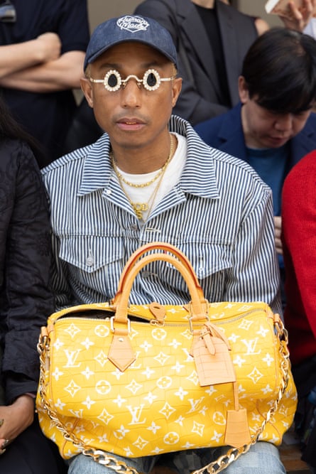 Pharrell Williams with the Millionaire Speedy bag at Paris fashion week.