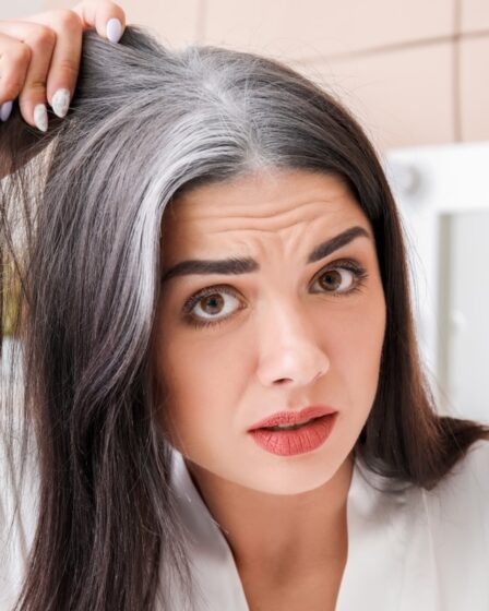 Woman Looking at gray Hair