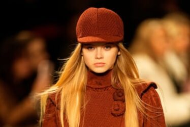 Model in Chanel’s Metiers d'Art show, Manchester, wearing a baker boy cap