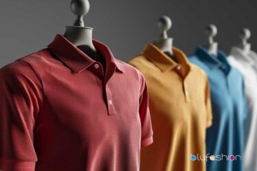 Assortment of colorful polo shirts on mannequins against a grey background.
