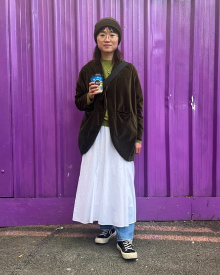 Zijing Xia, 26, visiting the UK from China, wears a white cotton skirt over baggy jeans. ‘I’ve done it to keep me warm, but also because early 00s fashion is back,’ she says.