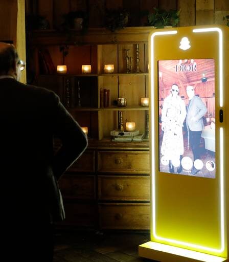 Guests interact with Snap Inc.'s AR mirror onsite at BoF VOICES 2023.