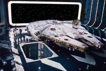 The Star Wars Millennium Falcon, guarded by stormtroopers