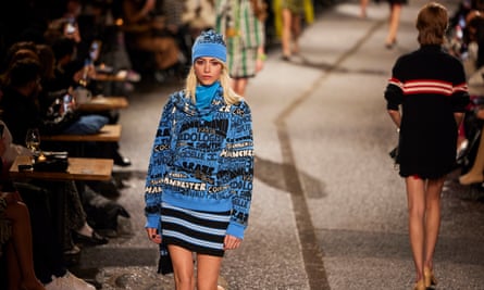A model wearing a blue Chanel jumper
