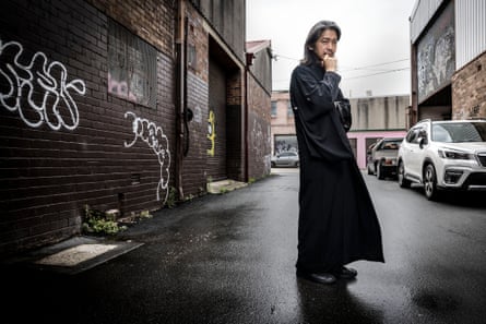 Akira Isogawa in his black, silk kimono outside his studio in Marrickville, Sydney.