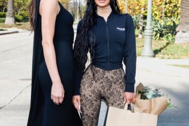 Kendall Jenner and Kim Kardashian attend the Balenciaga Fall 24 Show on 2 December 2023 in Los Angeles, California