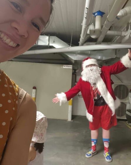 ‘Like all celebrity entourages, we enter the venue via an underground car park’: Kelly Eng and ‘Santa’ during their afternoon visit to their children’s daycare centre.