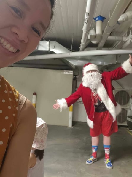 ‘Like all celebrity entourages, we enter the venue via an underground car park’: Kelly Eng and ‘Santa’ during their afternoon visit to their children’s daycare centre.