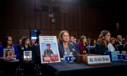 Kristin Bride sits next to a photo of her 16-year-old son Carson Bride as she appears before a Senate Committee on the Judiciary hearing to examine protecting our children online, in the Hart Senate Office Building in Washington, DC, Tuesday, February 14, 2023.