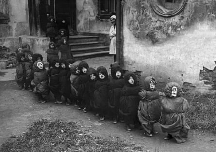 Children at a home in Moscow, muffled up in sleeping bags on their way to a dorm room for their midday sleep