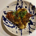 Chef Wan’s chicken rendang is topped with chillies and makrut lime leaves.