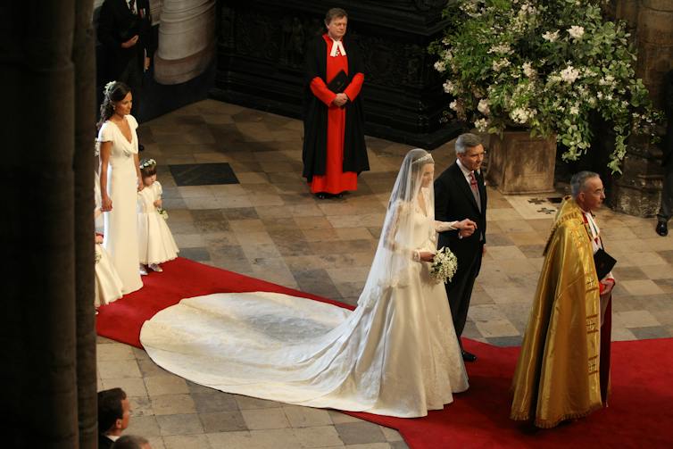 The bride walks down the aisle.