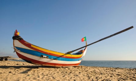 Praia da Aguda is sheltered by a sea wall.