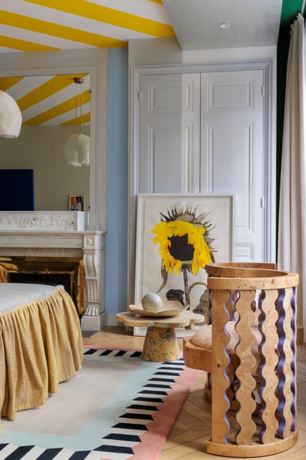 Sunny delight: the bedroom with Gio Ponti yellow ceiling stripes.