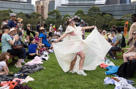 A woman shows off her newly created outfit made from a curtain at Fast Fashun.