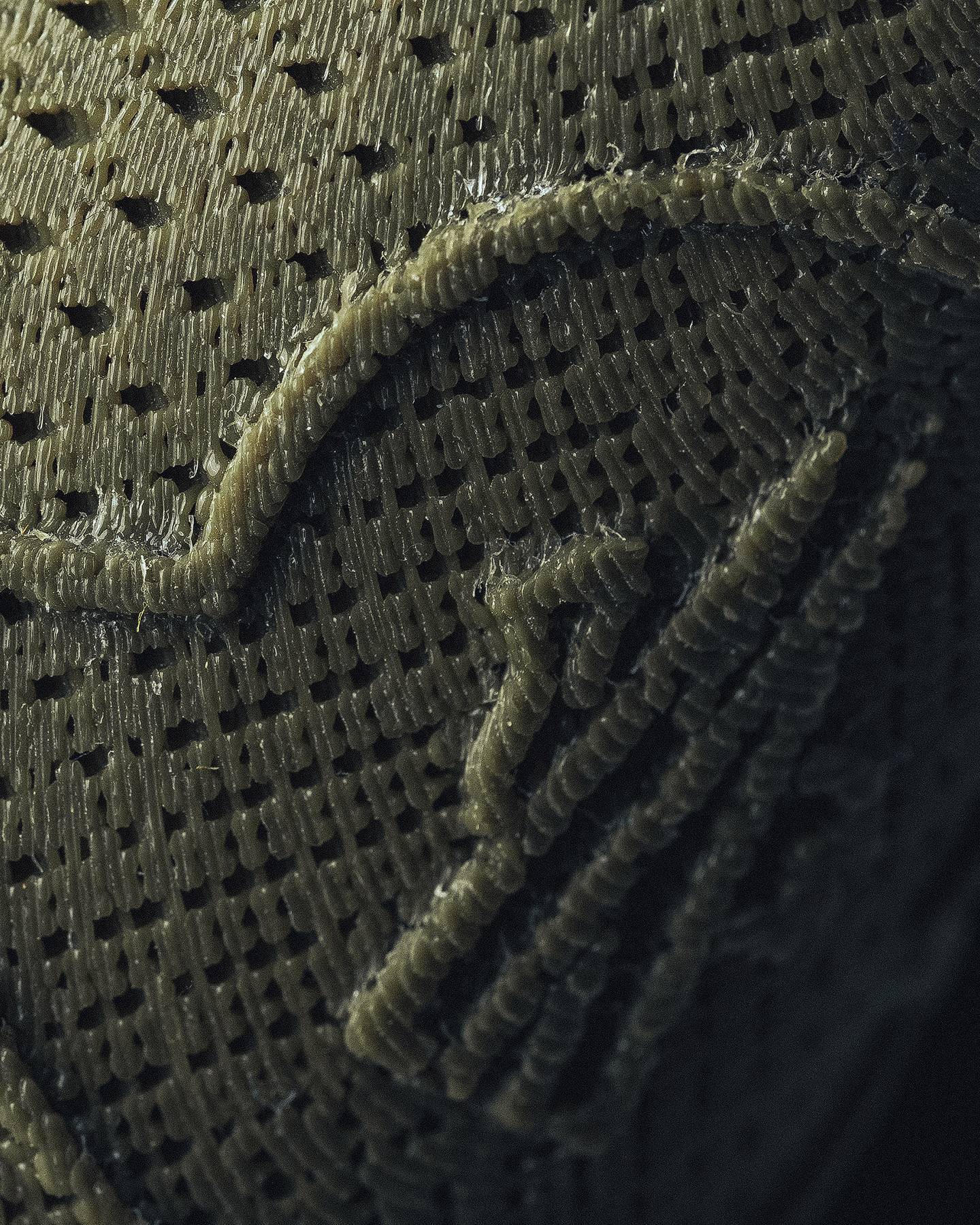 A close-up shot shows the texture of the 3D-printed material.