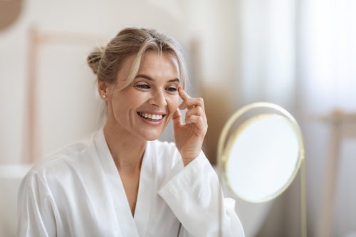 woman using eye cream