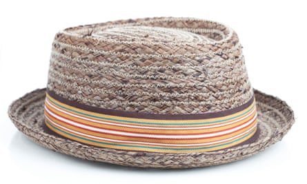 Brown pork pie hat with an orange and white striped hat band, on a white background