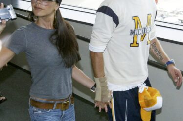 David Beckham and his wife Victoria walk through New Tokyo International Airport on June 22 2003.