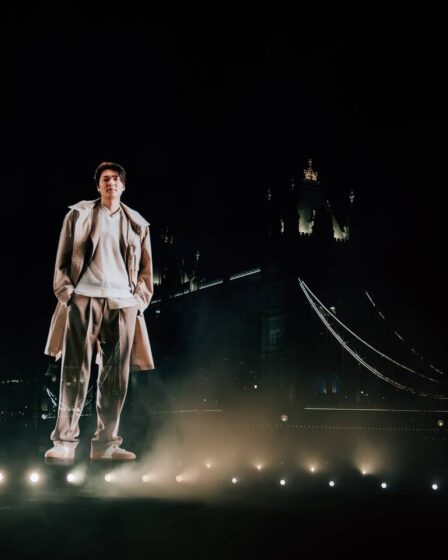 A semi-transparent hologram of Lee Min-ho stands in front of Tower Bridge.