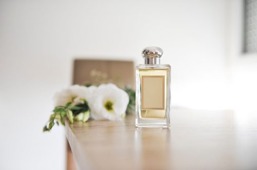 perfume bottle on wooden table