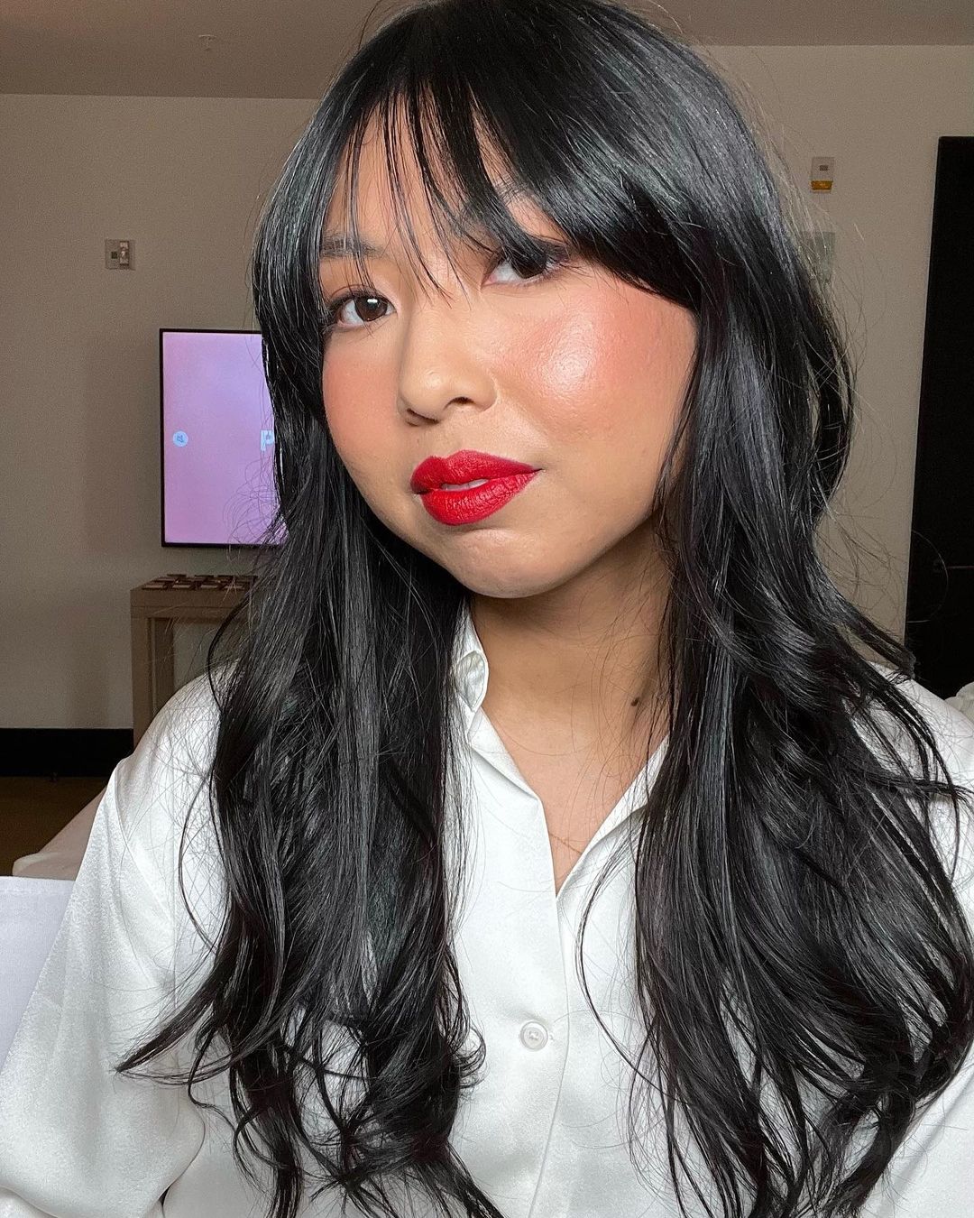Senior beauty editor Ariana Yaptangco wearing PATRICK TA Major Headlines Matte Suede Lipstick in That's Why She's Late.