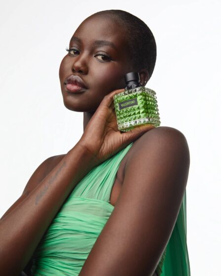 Adut Akech poses in a campaign for Valentino Born in Roma's "Green Stravaganza" flanker.