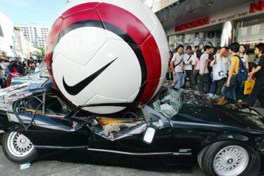 A Nike football crushing a BMW car in Thailand