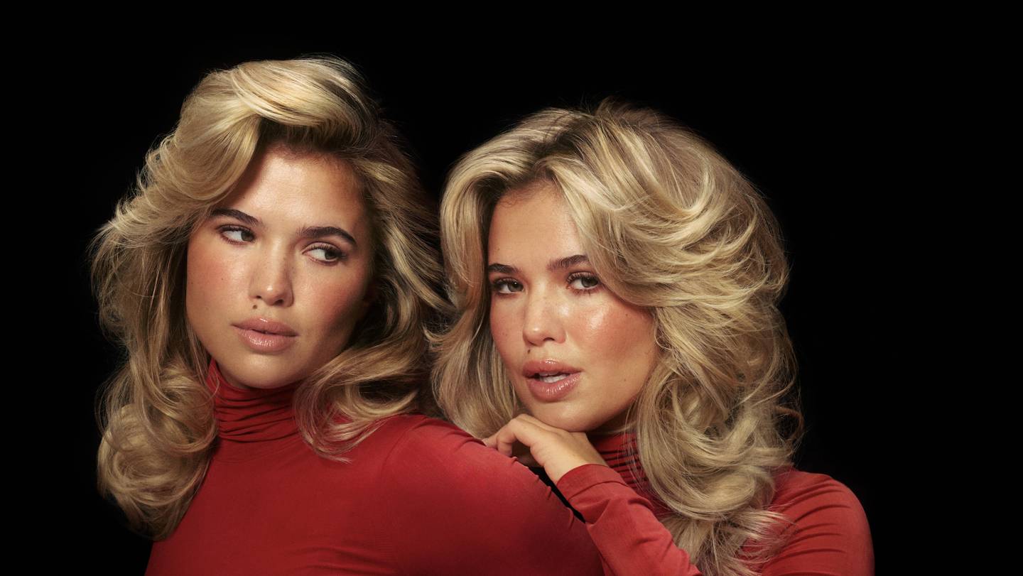 A promotional photo of Matilda Djerf in a red turtleneck for her new hair care brand, Djerf Avenue Beauty.